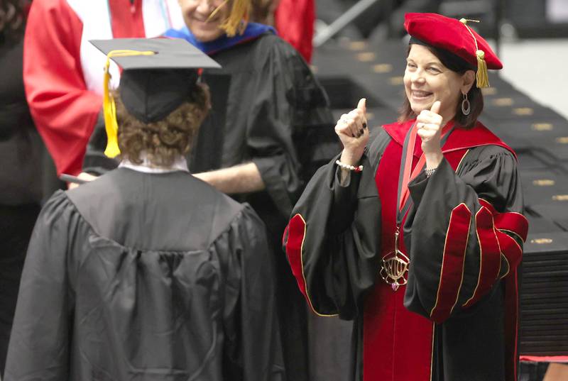 Northern Illinois University President Lisa Freeman congratulates graduates as they receive their diplomas Saturday, May 14, 2022, during the first of two undergraduate commencement ceremonies in the Convocation Center at NIU in DeKalb.