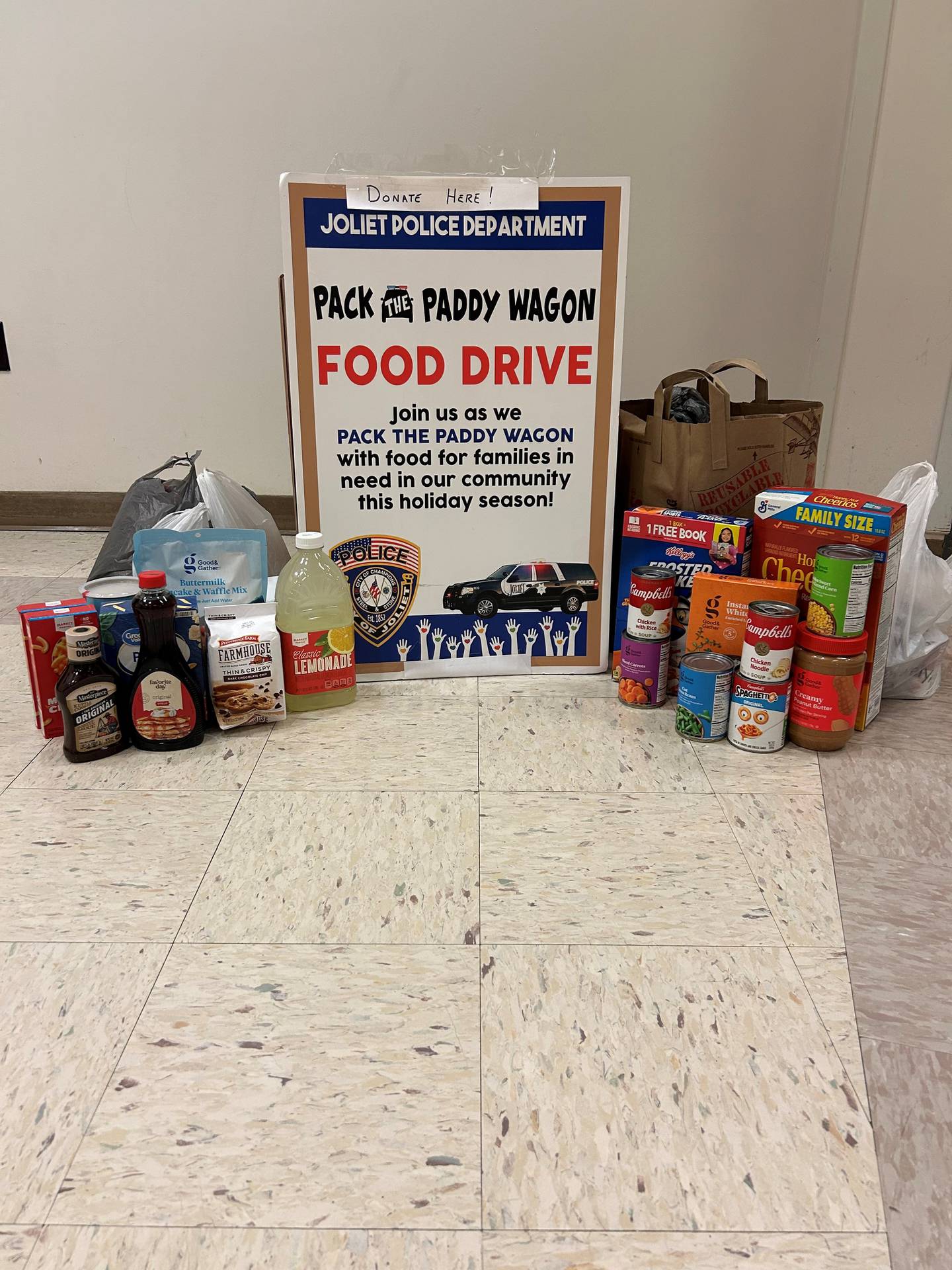 A collection of food sits at the Joliet Police Department in downtown Joliet for the annual Pack the Paddy Wagon Food Drive.