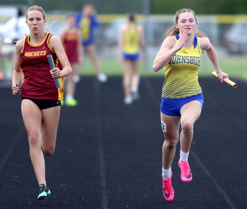 Johnsburg’s Summer Toussaint, right, and Richmond-Burton’s Sydney Frericks, left, complete the 400-meter relay in KRC Conference Track Meet action at Marengo High School in Marengo on Tuesday, May 6, 2025.