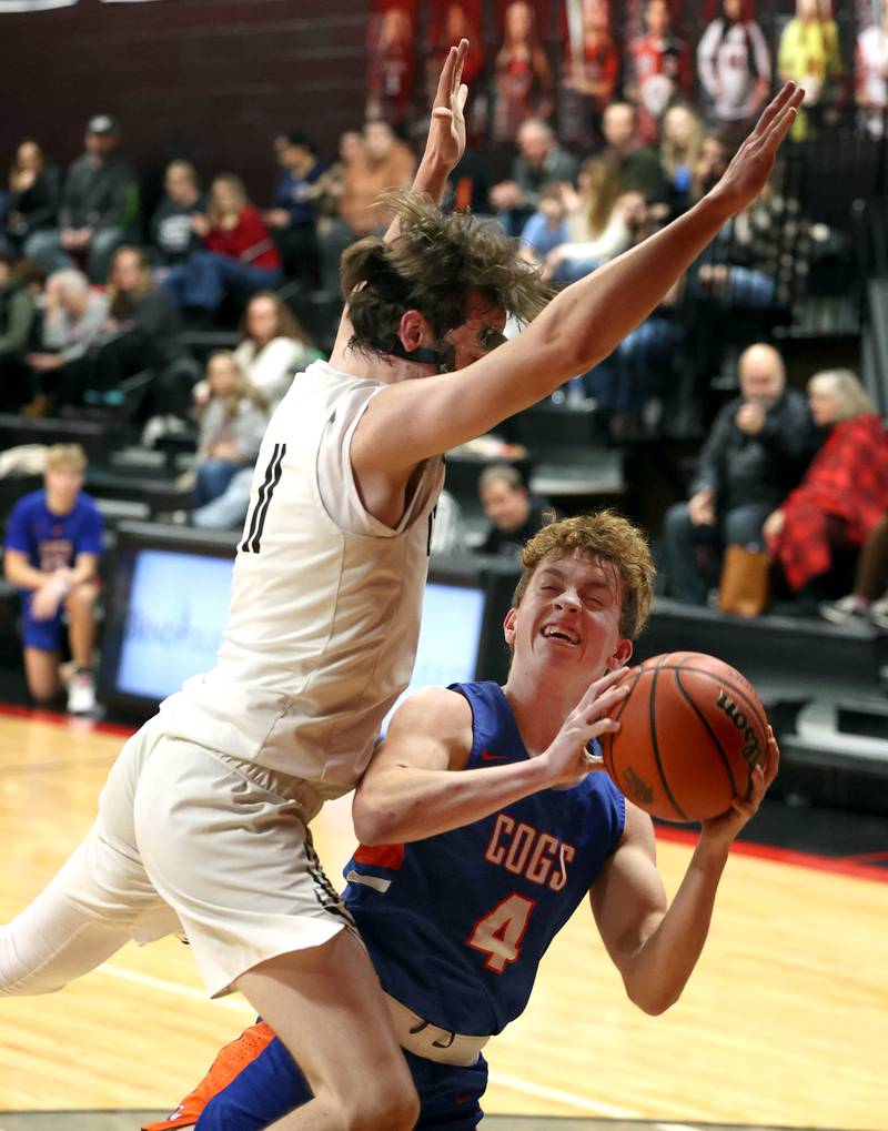 Genoa-Kingston's Ethan Vasak is fouled by Indian Creek's Jeffrey Probst Wednesday, Jan. 25, 2023, during their game at Indian Creek High School in Shabbona.