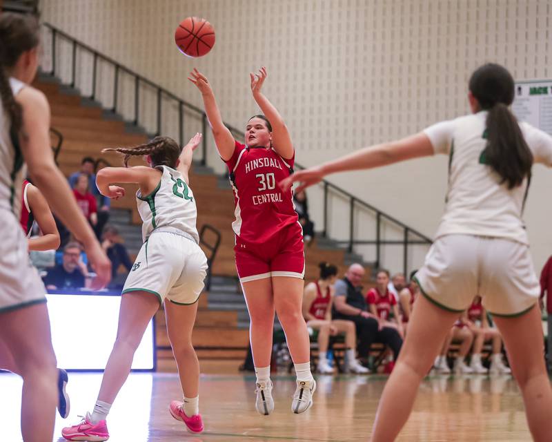 Hinsdale Central's Luella Sheehan (30) shoots a jump shot during basketball game between Hinsdale Central at York. Dec 8, 2023.