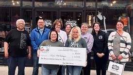 Mud & Moo receives check for facade improvements