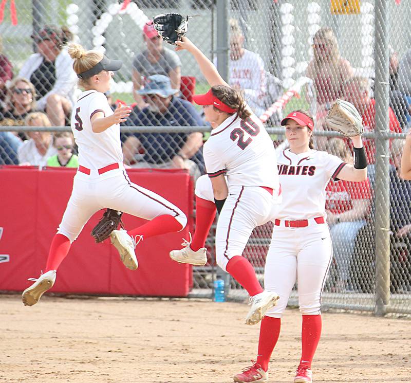 Ottawa's Grace Carroll and Ottawa's Kendall Lowery leap in the air while running off the field against Morris on Monday, May 15, 2023 at Ottawa High School.