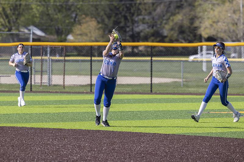 Newman’s Lucy Oetting puts the squeeze to a pop up against Sterling Thursday, April 27, 2023.