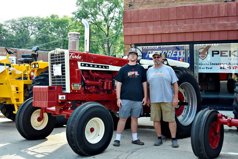 Nolan Gerlach with dad Jamie, shows off his 1967 IH Farmall 1206 Saturday, August 9, 2025 in Prophetstown. Nolan took 2nd place in the show tractor category of the car/truck/tractor show during the Make a Farmer festival.