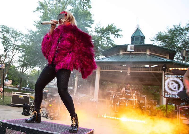 Hello Weekend singer Christina performs during North Aurora's annual Independence Day celebration at Riverfront Park in North Aurora on Monday, July 3, 2023.