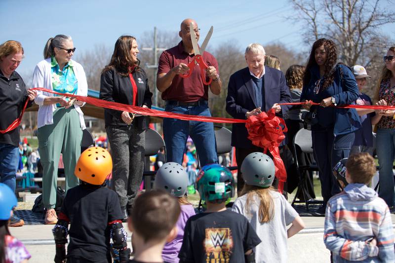 Skaters gather to watch the ribbon cutting ceremony for the skate park at Clark Island Recreation area on Saturday, April 12, 2025 in Batavia.
