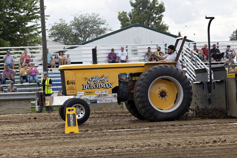 Aiden Smith gives his Moline G705 the gas Thursday, July 24, 2025, as he heads down the track in Amboy.