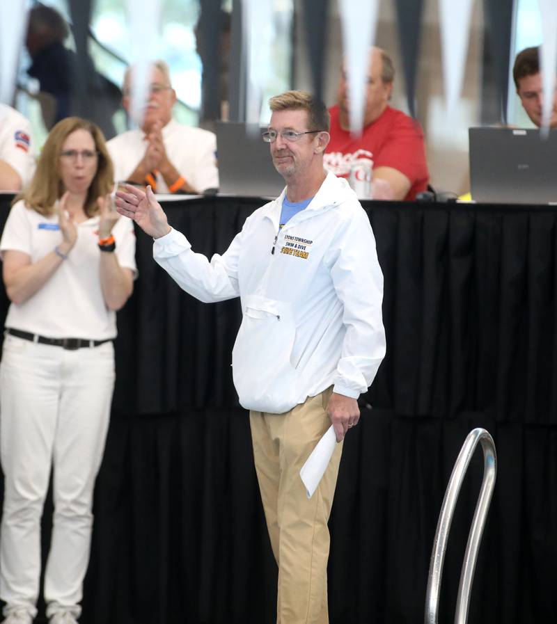 Lyons Township Head Coach Scott Walker is honored during the IHSA Girls State Championships on Saturday, Nov. 16, 2024 at FMC Natatorium in Westmont.