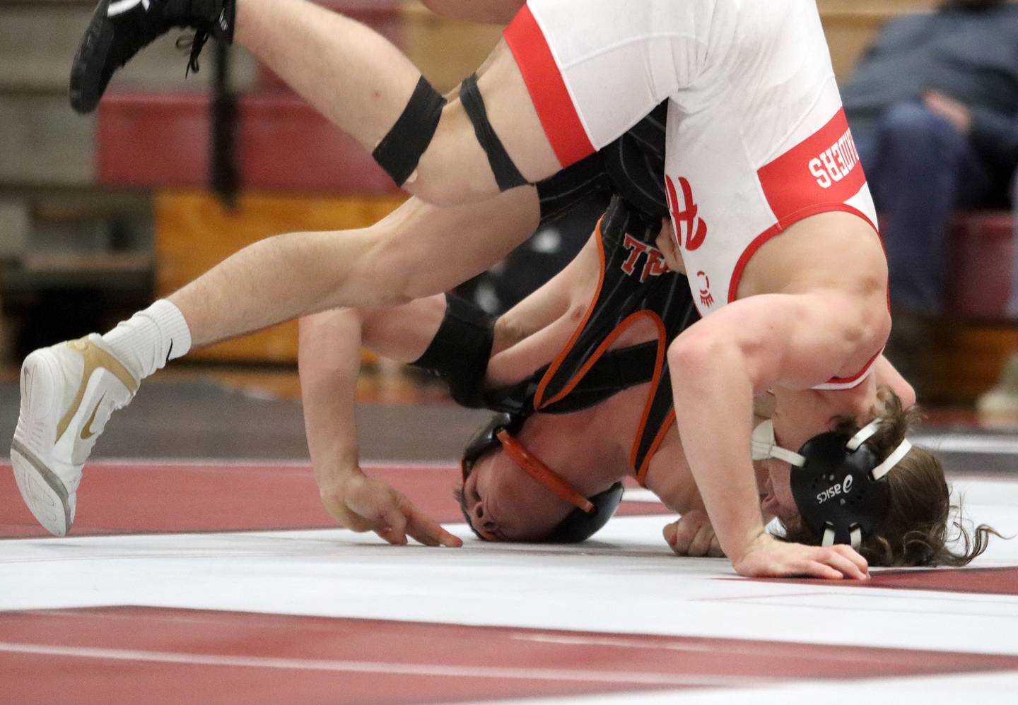 Huntley’s Lucas Bittman battles Crystal Lake Central’s Tommy Tommasello at 165 pounds in varsity wrestling on Friday, Dec. 13, 2024 at Huntley High School in Huntley.