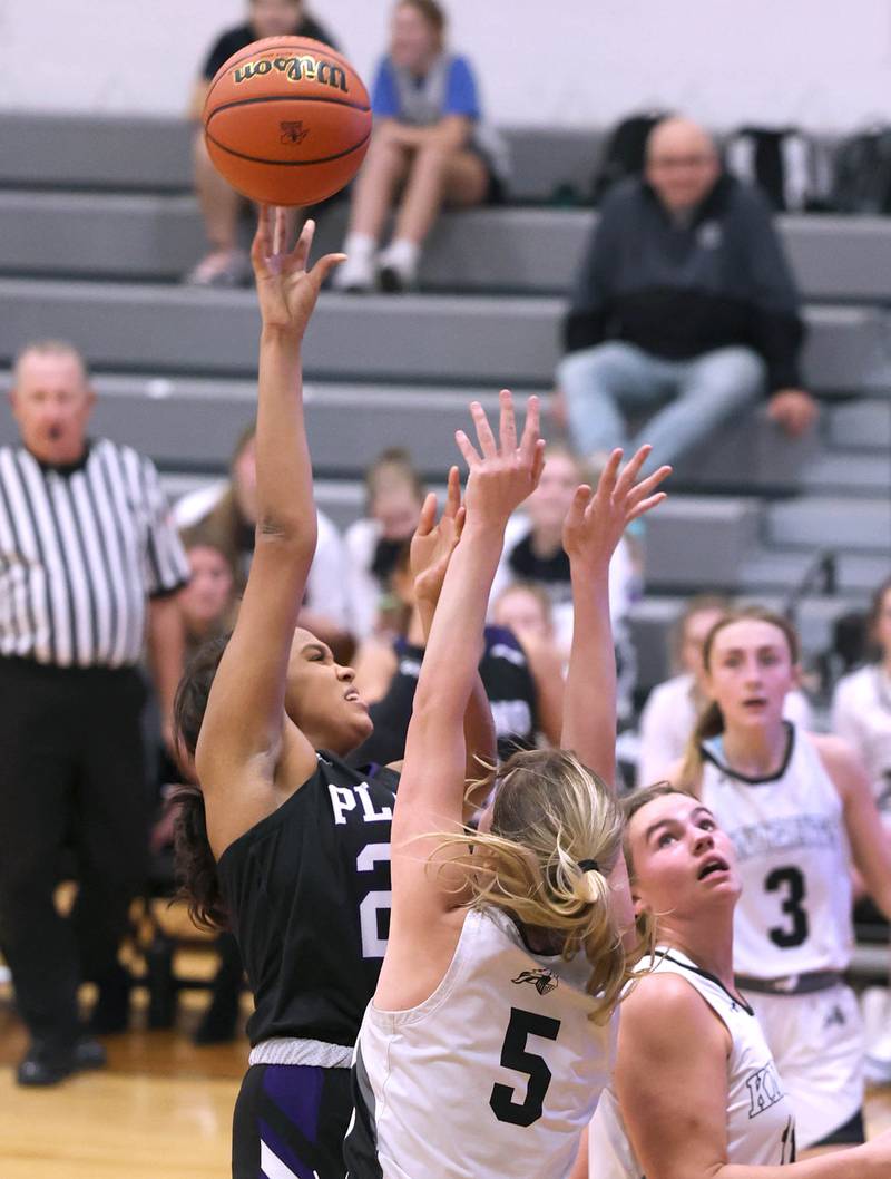 Plano’s Mikayla Walls shoots over Kaneland’s Brigid Gannon during their game Tuesday, Dec. 13, 2022, at Kaneland High School in Maple Park.