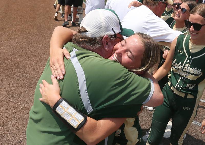 St. Bede pitcher Ella Hermes hugs head softball coach Shawn Sons after winning the Class 1A State championship over Illini Bluffs on Saturday, June 3, 2023 at the Louisville Slugger Sports Complex in Peoria.