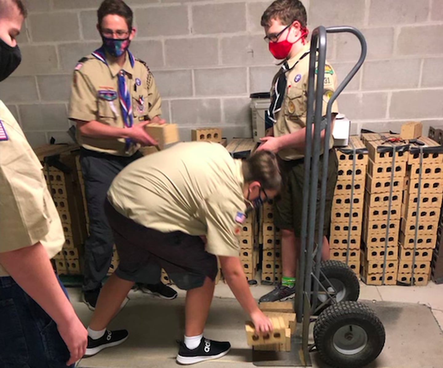 Boy Scout Troop 31 helping the Oswego Senior and Community Center get their new home ready to open at 3525 Route 34. (Photo courtesy of OSCC)