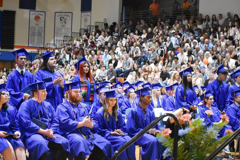 Graduates and their families applaud during the commencement ceremony Saturday, May 20, 2023, at Genoa-Kingston High School.