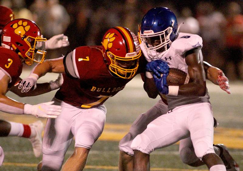 Batavia's Tyler Jansey (7) goes after Phillips' Jahon Walker during the first game of the season in Batavia on Friday, Aug. 27, 2021.