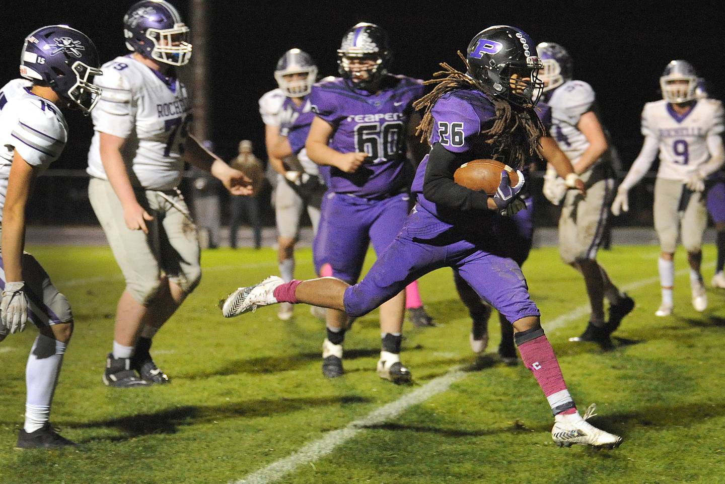 Plano runningback Da'Ziyon Wright (26) hops into the endzone for a touchdown against the Rochelle defense during a varsity football game at Plano High School on Friday.