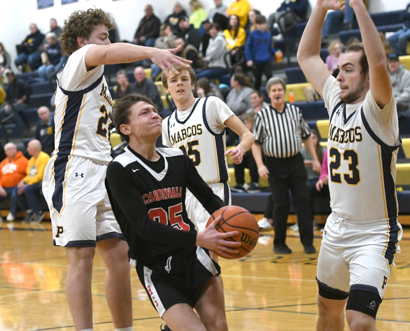 Forreston's Kendall Erdmann drives to the basket as Polo's Brady Wolber (22) and Cayden Webster (23) defend during a NUIC game in Polo on Thursday, Jan. 19.