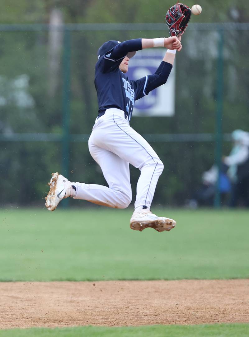 Downers Grove South's Will Potter (6) goes up for the ball during the varsity baseball game between Downers Grove South and Downers Grove North in Downers Grove on Saturday, April 29, 2023.