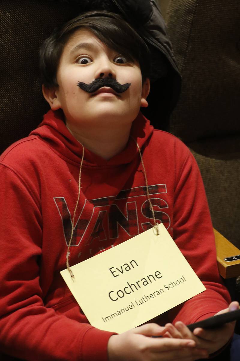 Evan Cochrane of Immanuel Lutheran relieves some stress before the start of the McHenry County Regional Office of Education 2023 Spelling Bee Wednesday, March 22, 2023, at McHenry County College's Luecht Auditorium in Crystal Lake.