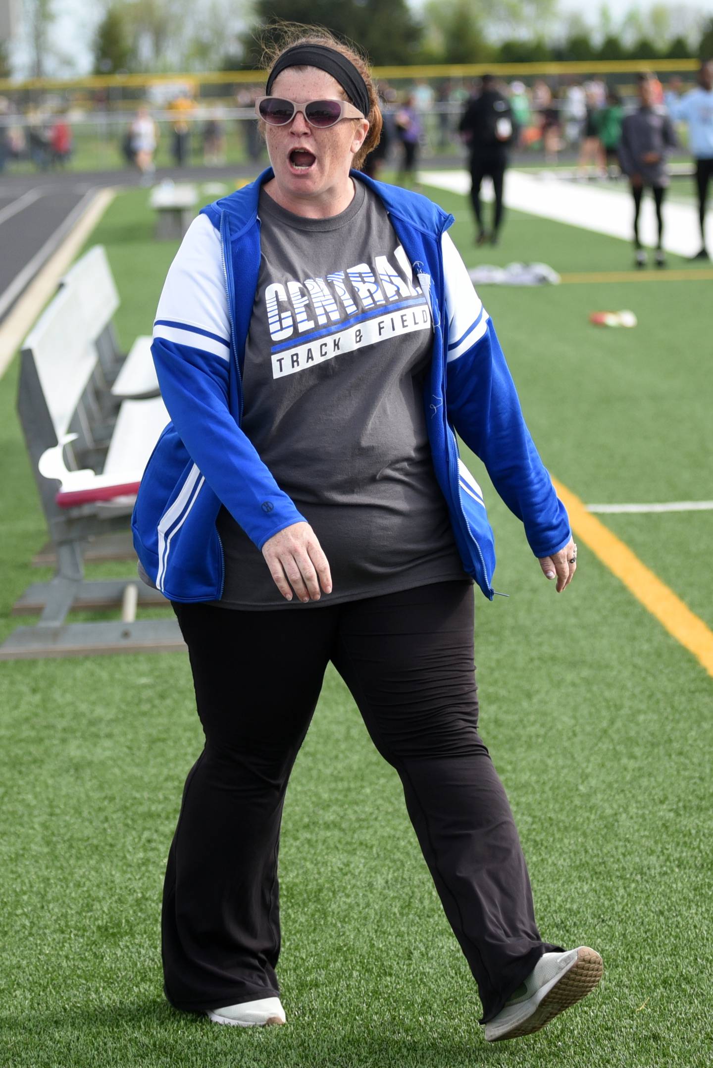 Central girls track and field coach Rebecca Swigert-Fenton cheers on her 4x800 m relay team at the Herscher Invite Friday, May 2, 2025.