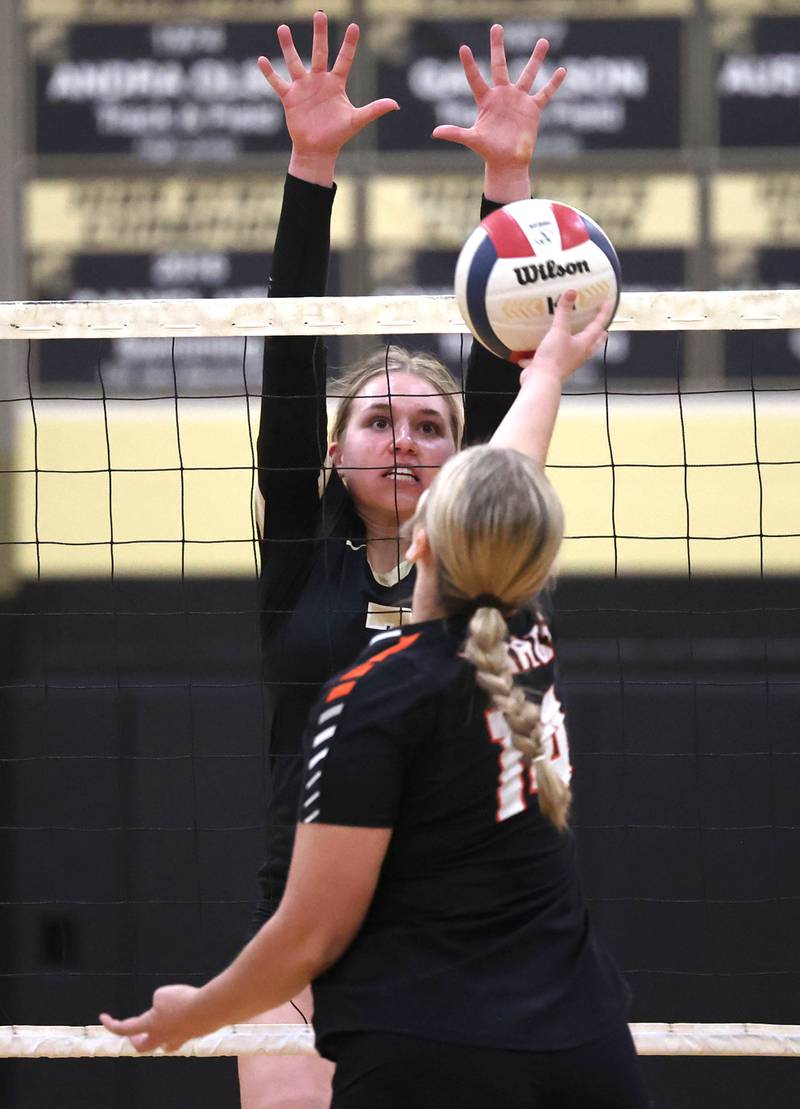 Sycamore's Laci Neece tries to block the tip of DeKalb’s Brooklynn Siebrasse during their match Monday, Oct. 16, 2023, at Sycamore High School.