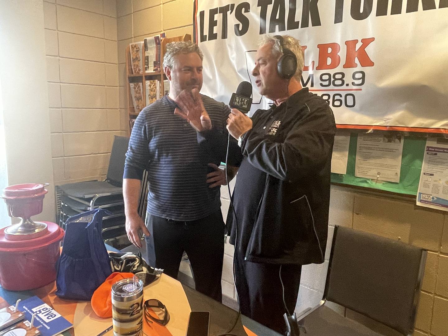 Sycamore Rotary Club president Brandon Diviak (left) and WLBK radio host TD Ryan speak Nov. 17, 2023 during a live broadcast from the DeKalb Salvation Army.