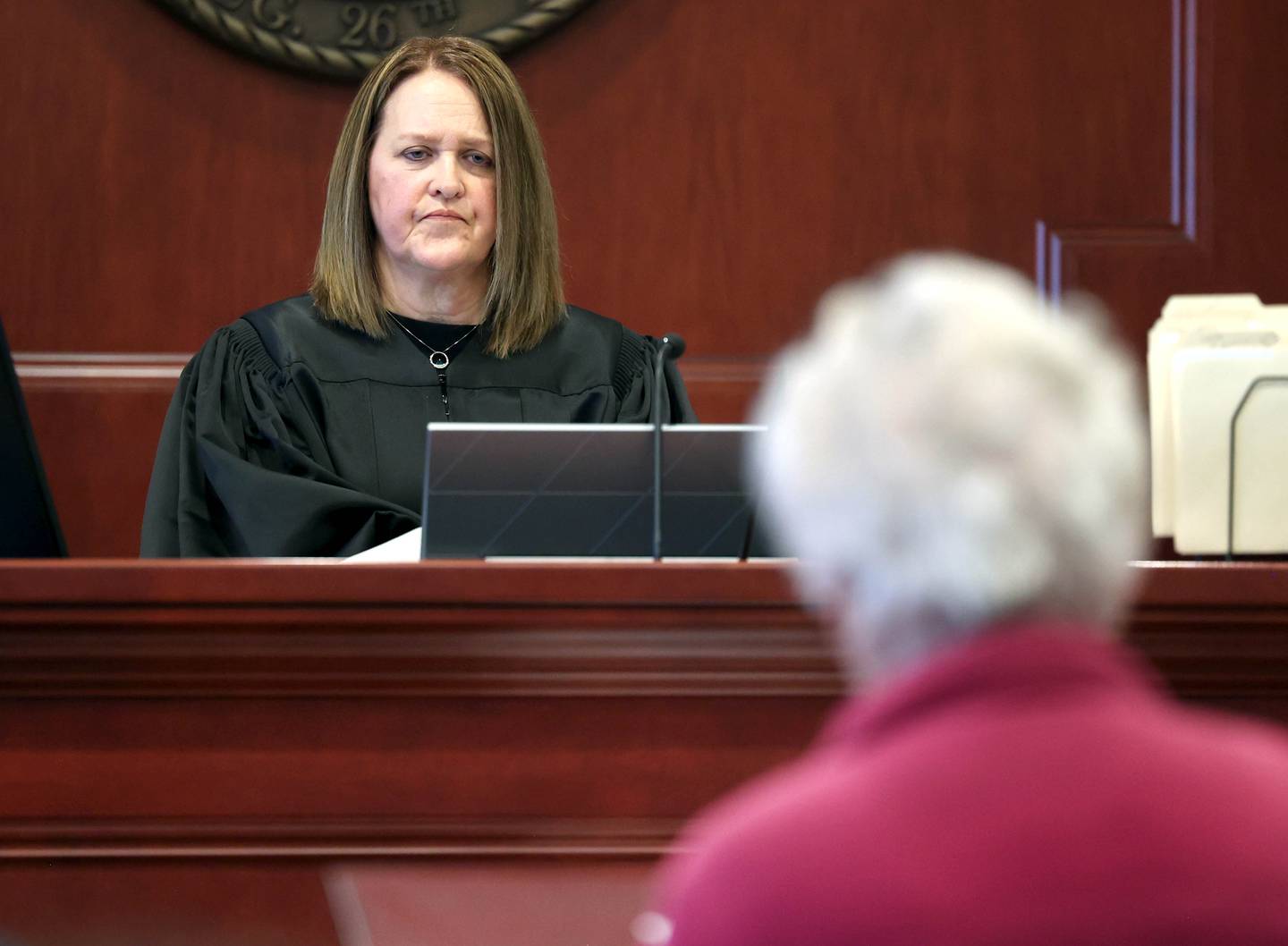 Circuit Court Judge Marcy Buick listens as a victim impact statement is read on Thursday, March 20, 2025, at the DeKalb County courthouse, by Nancy Strever, a family member of Sycamore murdered mother and son Patricia and Robert Wilson. Patricia was Strever's sister and Robert's aunt. Jonathan D. Hurst was convicted of the killings and was sentenced Thursday to life in prison.