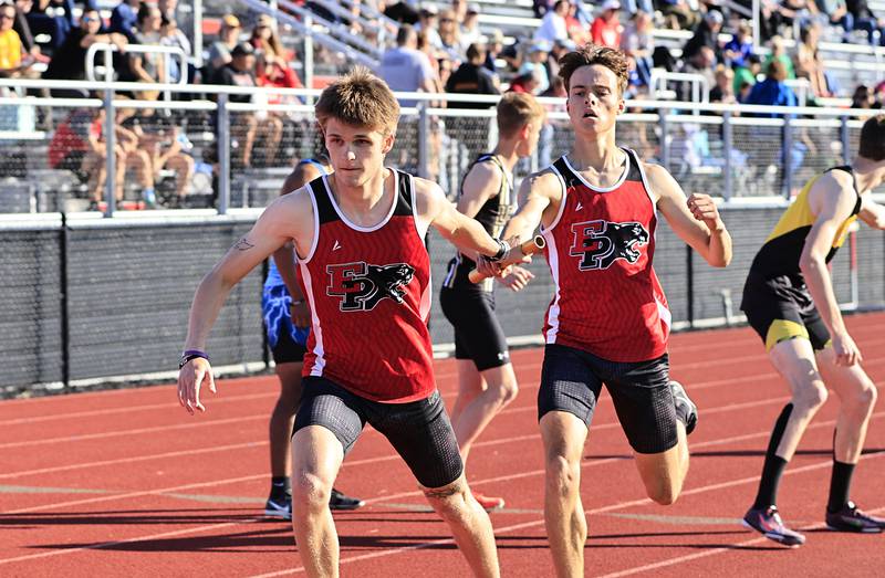 EP's Nathan Punke hands off the baton to teammate Justin Wainscott in the 4 x 800m relay on Wednesday in Erie at the IHSA sectional meet. The 4 man team of Nathan Punke, Braeden Punke, Justin Wainscott and Gus Schultz finished the race with a time of 8:23.40, enough for 3rd place and advancing them to the state finals next week.