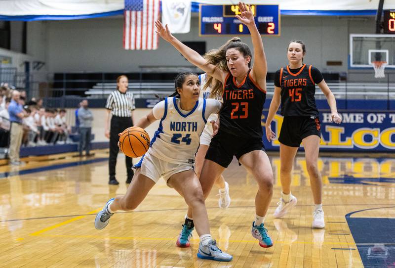 Wheaton North’s Sara Abdul drives the lane during a game against Wheaton Warrenville South at Wheaton North High School on Friday, Dec. 20, 2024.