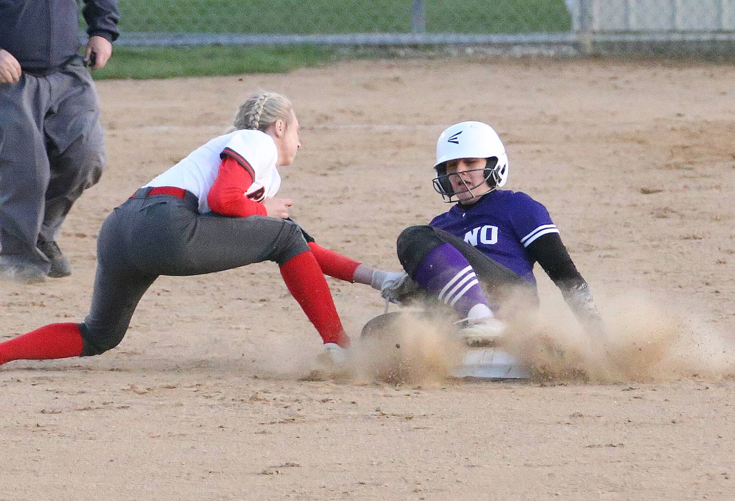 Ottawa's Ryleigh Stehl misses a tag on Plano's while stealing second base on Thursday, April 6, 2023 at King Field in Ottawa.
