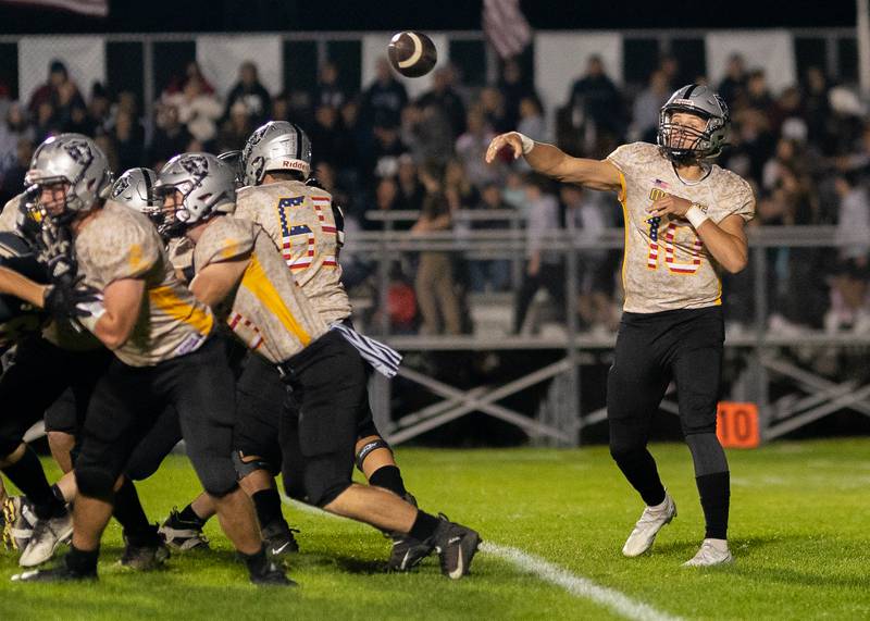 Kaneland’s Troyer Carlson (10) throws a pass against Sycamore during a football game at Kaneland High School in Maple Park on Friday, Sep 30, 2022.