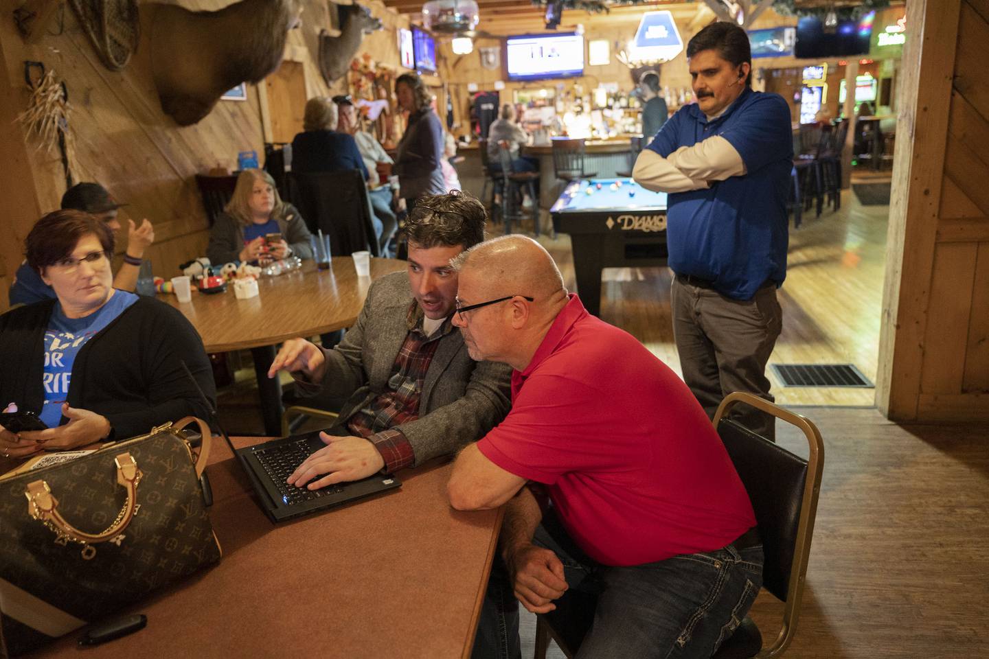 Louis Pignatelli (left) and Mike Lewis check results Tuesday, Nov. 8, 2022 at Wagon Wheel in Sterling.