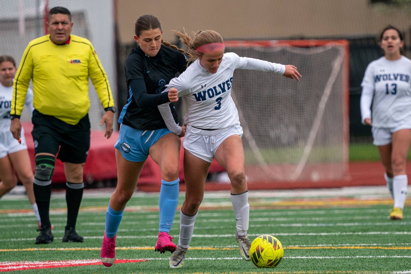 Oswego East's Anya Gulbrandsen (3) plays the ball against St. Charles North's Kayla Floyd (2) during a Naperville Invitational soccer match at Naperville Central High School on Saturday, April 22, 2023.