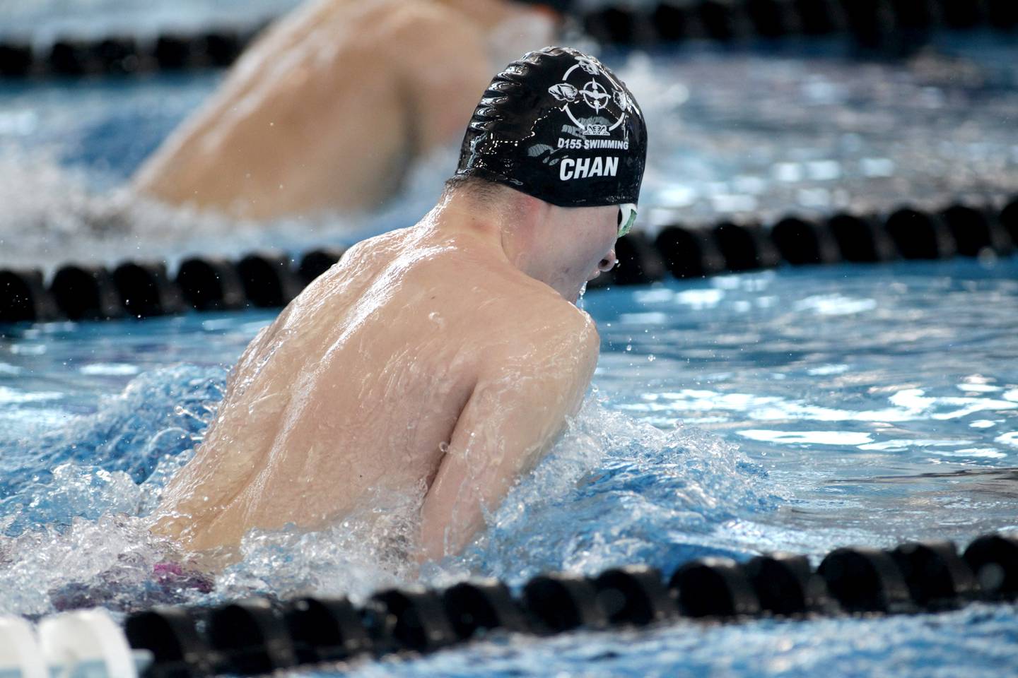 Cary-Grove co-op's Connor Chan swims the breaststroke leg of the 200-yard medley relay consolation heat during the IHSA Boys State Championships at FMC Natatorium in Westmont on Saturday, Feb. 25, 2023.
