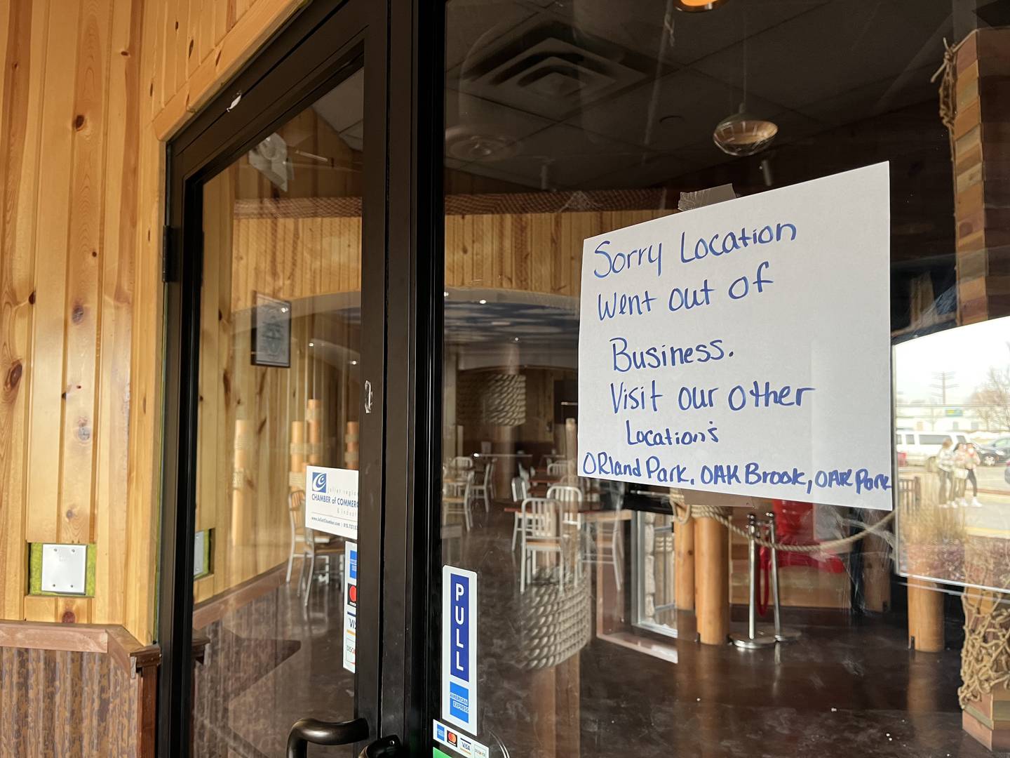 Sign posted on one of the two entrances to Cajun Boil & Bar, 3340 Mall Loop Drive, Joliet, seen on Wednesday, Feb. 8, 2023.