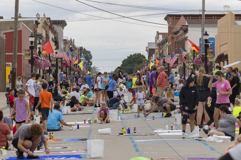 Thousands line and beautify the streets Saturday, Sept. 20, 2025, during Morrison’s Paint the Town.