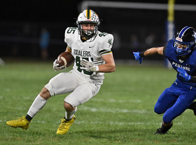 Coal City's Landin Benson runs the ball  during a conference game against Peotone on Friday, Sep 27, 2024 at Peotone. (Dean Reid for Shaw Local News)