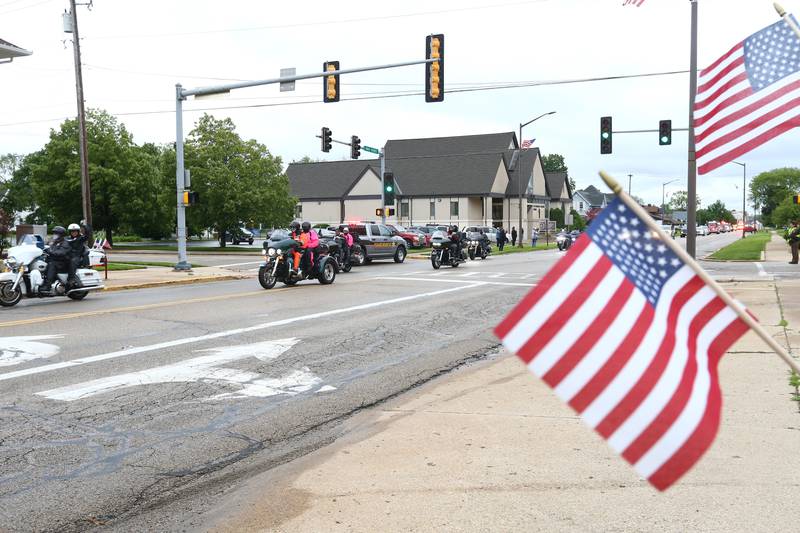 Veterans driving motorcycles parade down Main Street in Princeton during a parade featuring the Vietnam Vets Memorial Wall on Friday May 28, 2021.