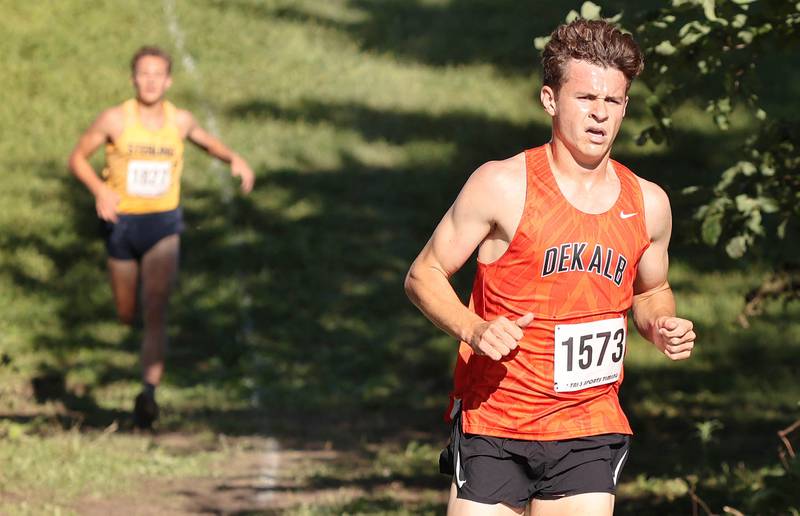 DeKalb's Riley Newport leads the boys race just ahead of Sterling's Dale Johnson Tuesday, Aug. 30, 2022, during the Sycamore Cross Country Invitational at Kishwaukee College in Malta. Newport went on to win the race.