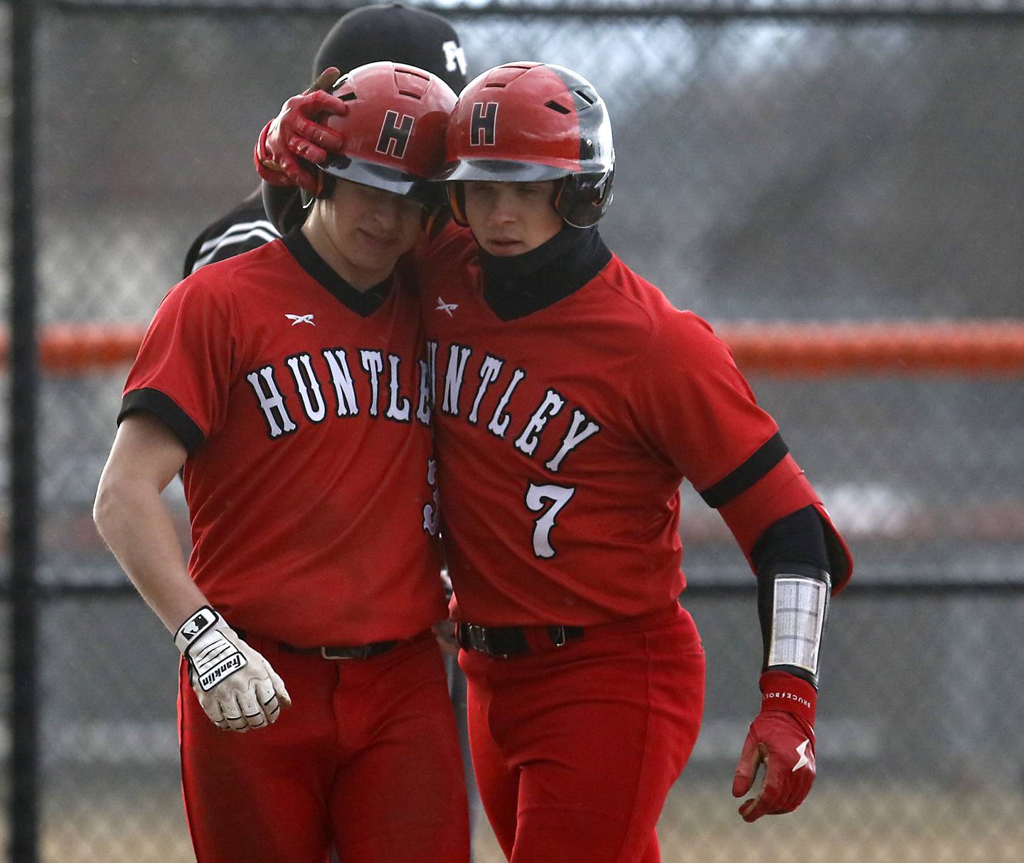 Huntley’s Ryan Bakes, right, hugs his teammate, Nick Martino, after Bakes hit second home run during a Fox Valley Conference baseball game Wednesday, April 6, 2022, between Crystal Lake Central and Huntley at Crystal Lake Central High School.