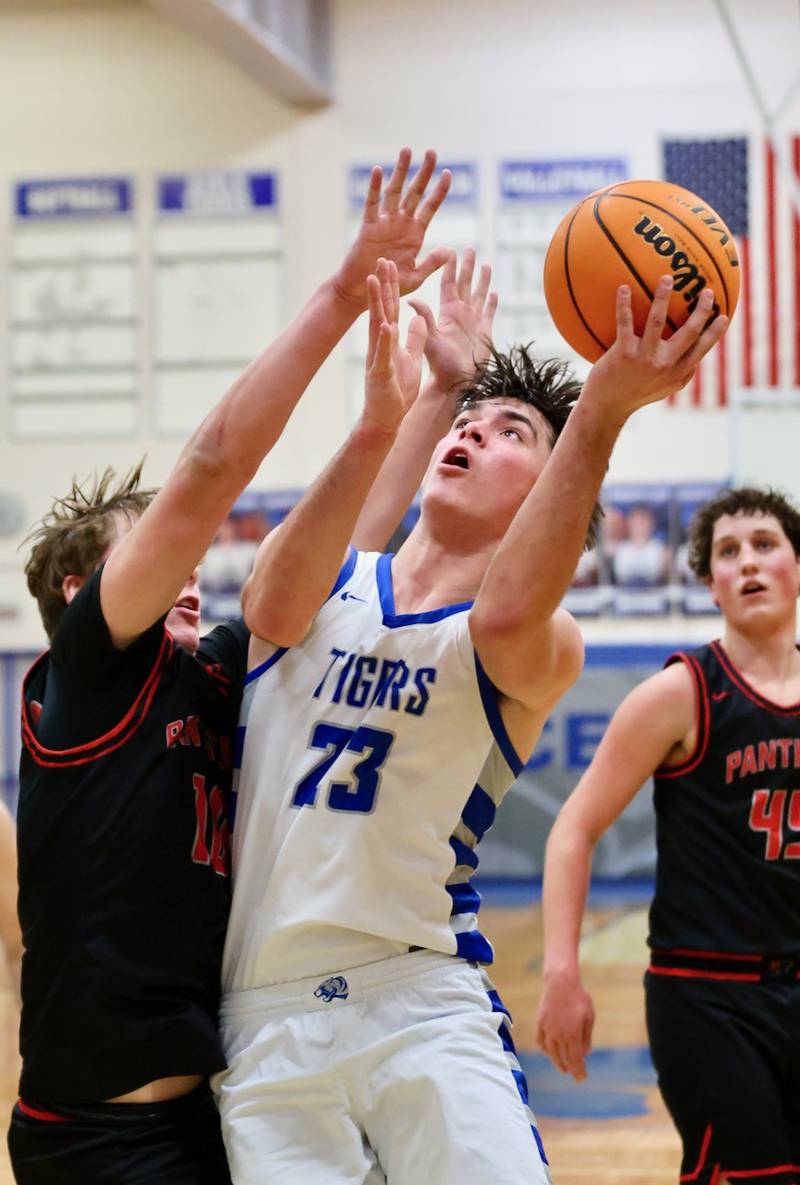 Princeton senior Noah LaPorte powers up for a shot Friday at Prouty Gym. He scored 14 of his. game-high points to lead the Tigers to a 60-37 over Erie-Prophetstown.
