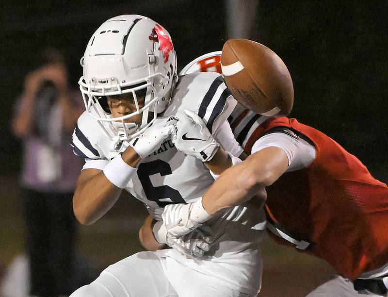 Benet Academy’s Martin Radgowski braks up a pass for Saint Viator’s Damacio Ortegon in a football game at Benedictine University in Lisle on Friday, Sept. 20, 2024.