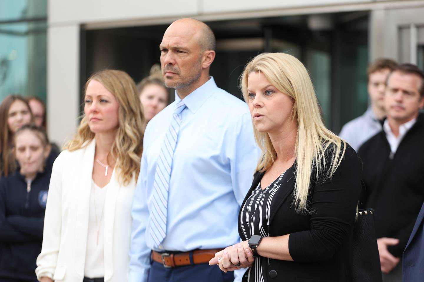 Stacie Mroz, right, a friend of the Goewey family speaks to the press outside Will County Courthouse during a press conference. Edward Goewey, a Will County sheriff’s deputy currently on medical leave, is being charged with disorderly conduct accusing him of disturbing Mokena school officials when he insisted on the removal of a student he believed made a shooting threat at St. Mary Catholic school. Monday, April 11, 2022, in Joliet.