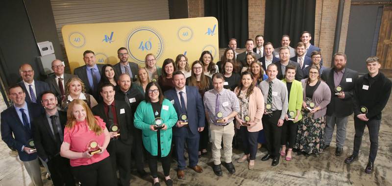 Recipients pose for a group photo during the Illinois Valley Chamber of Commerce 40 Under Forty awards banquet on Thursday, March 21, 2024 at Westclox in Peru.