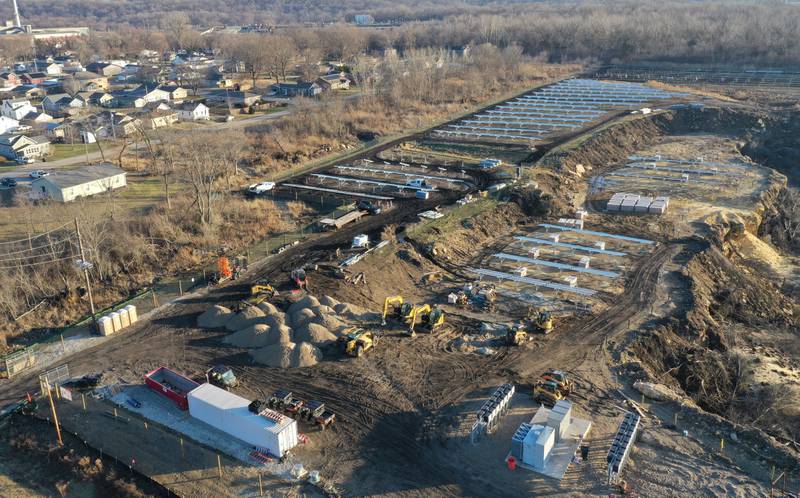 Crews prepare to erect a glass panel on the solar farm located in the 1400 block of North 27th Road (Dee Bennett Road) on Wednesday, Jan. 8, 2026 in Naplate.