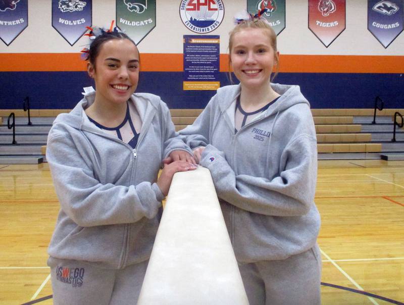 Oswego Co-op gymnasts Sam Phillip and Ava Sullivan