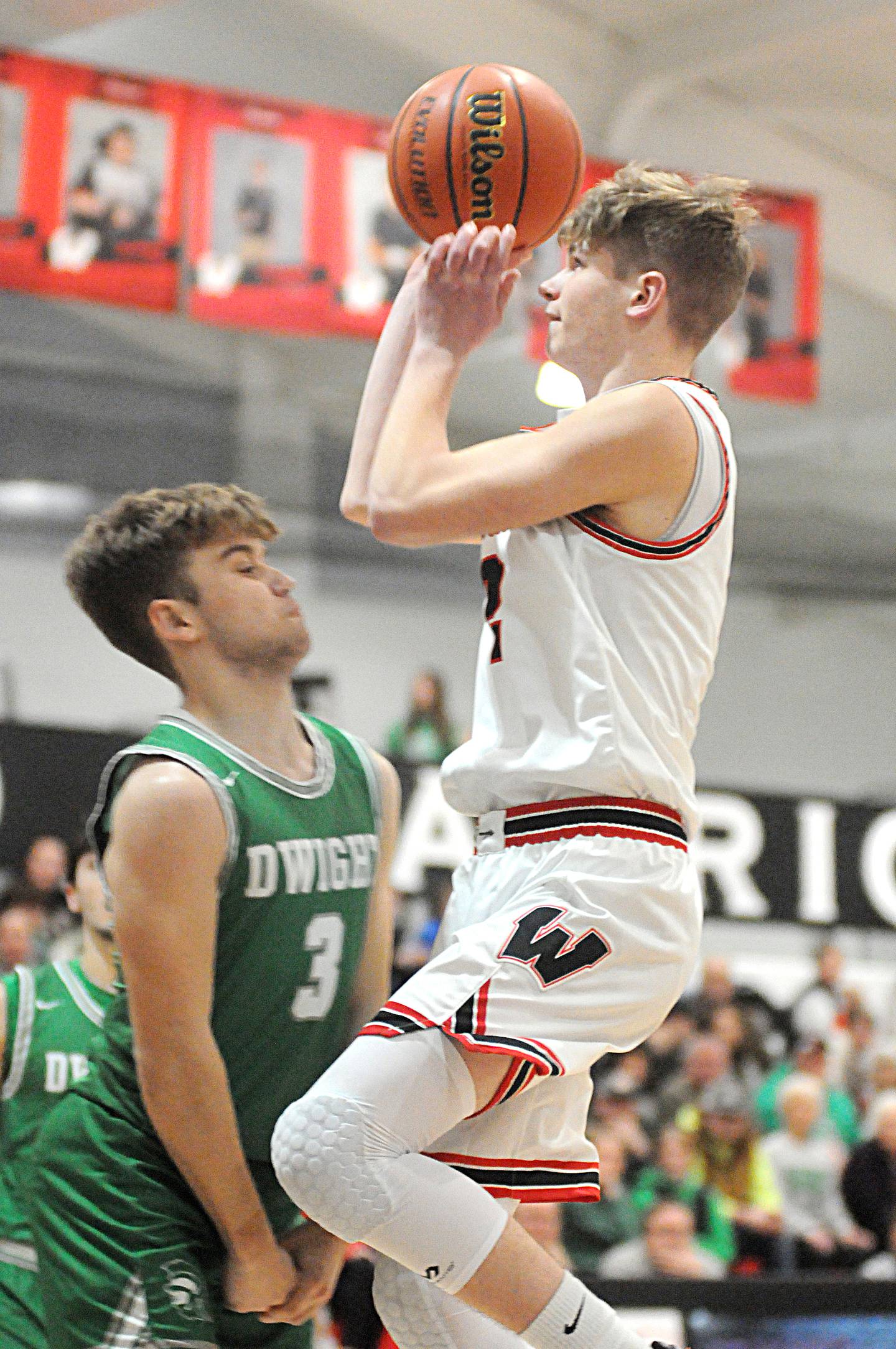 Woodland's Jon Moore shoots past the defense of Dwight's Conner Telford at the Warrior Dome on Friday, Jan. 13, 2023.