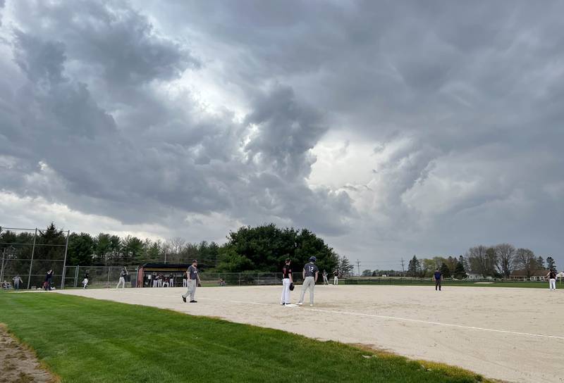 Indian Creek and Hiawatha play their game under a threatening sky Thursday, April 20, 2023, at Indian Creek High School in Shabbona. The game was stopped in the first inning due to weather.