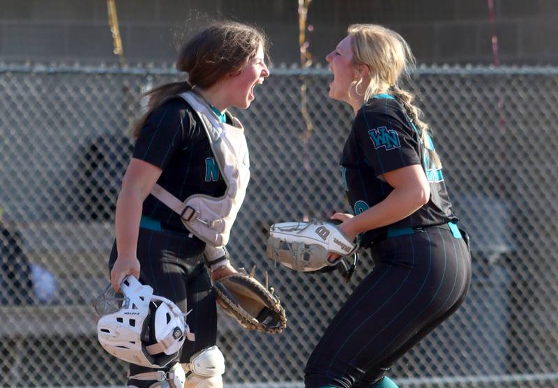 Woodstock North’s Norah Mungle, left, and Jo Jo Vermett celebrate after the final out of a win in varsity softball at Richmond on Thursday.