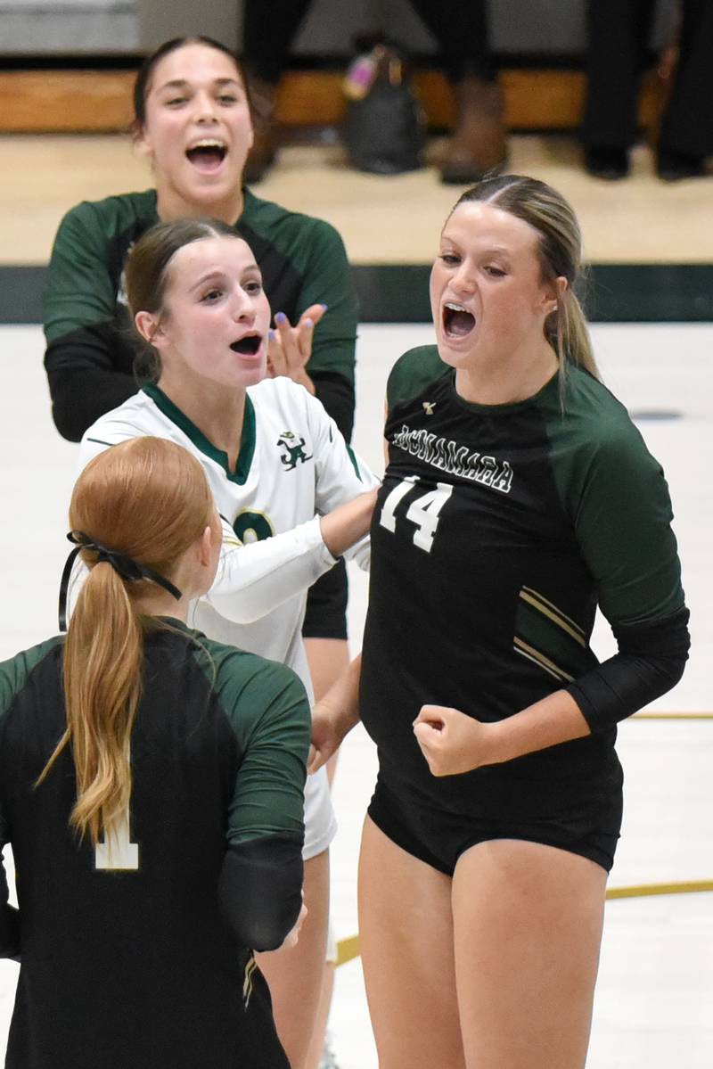 Bishop McNamara's Kate Dole, right, is congratulated by her teammates after recording a kill during a home game against Manteno Monday, Oct. 20, 2025.